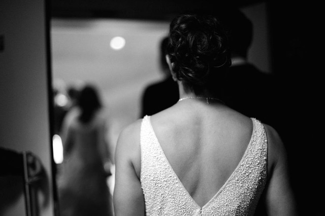 An elegantly dressed guest preparing for an evening out